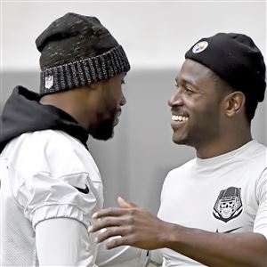 Antonio Brown greets Darrius Heyward-Bey on Monday.