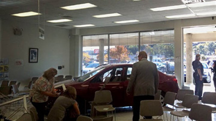 Car-crash-1.jpg Car crash A man crashed into a state Drivers License Center in Collier.