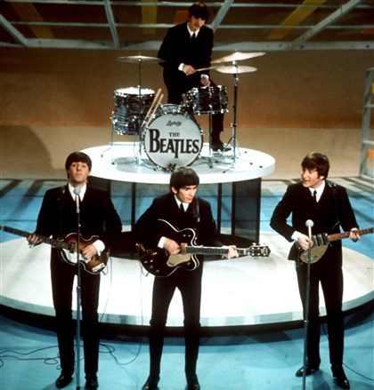 TV-Beatles-Sullivan The Beatles, from left, Paul McCartney, George Harrison, Ringo Starr on drums, and John Lennon perform on the CBS 
