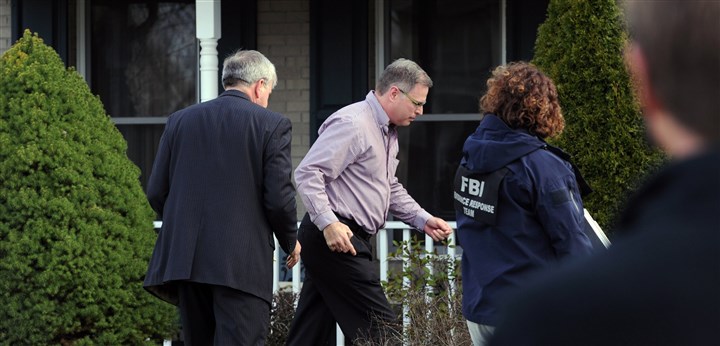 20140409JHLocalStabbing06.jpg 20140409JHLocalStabbing06 Harold Hribal, father of suspect, center, and FBI agents enter his house, at 3959 Sunflower Court.