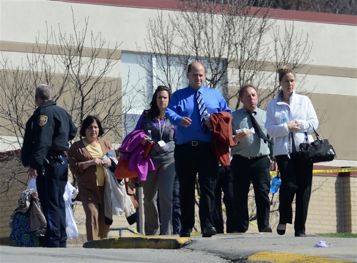 20140409radFRStabbingsLocal01-2.jpg Franklin Regional High School 5 Teachers and staff leave Franklin Regional High School Wednesday morning following the stabbing incident.