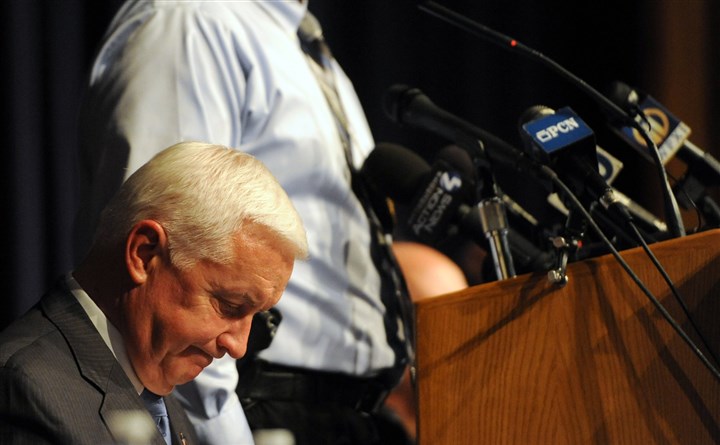 20140409MWHpresserLocal03-3.jpg 20140409MWHpresserLocal03-3 Gov. Tom Corbett listens as Murrysville police Chief Tom Seefeld speaks during a news conference Wednesday at Franklin Regional Junior High.