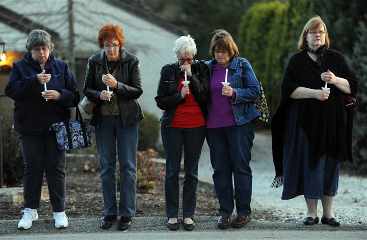 20140409MWHvigilLocal01-1.jpg 20140409MWHvigilLocal01-1 From left, Dorothy DiEugenio of Murrysville, Ruth Greer of Monroeville, Barb Stuffer of Penn Township, Joan Smeltzer of Latrobe and Susan Fox of Churchill stand across the street from Franklin Regional High School as churchgoers and community members hold a candlelight vigil and prayer service Wednesday.