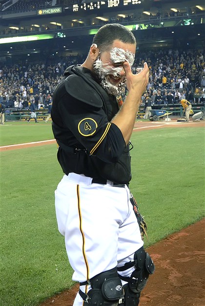 20140919pdPiratesSports08 Russell Martin takes a pie to the face from Neil Walker after beating the Brewers at PNC Park. 