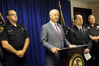  United States Attorney David J. Hickton with Gary Davis of the DEA on the right, announce a large drug bust of 19 individuals charged with prescription drug trafficking.  
