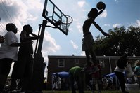  Mazzy Bailey, then 17, of Bedford Dwellings in the Hill District, goes in for a dunk in 2012 at a lowered rim during events at the Bedford Dwellings Community Day as organized by the Housing Authority. The authority won’t release its findings from an investigation into tenant council elections at the housing complex.