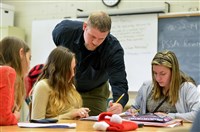  Teacher Bill Wolf helps students during a seventh grade math class at Pittsburgh South Brook in Brookline. Mr. Wolf participates in the DEbT-M math program.   