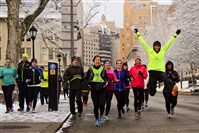 Karen Ilkin, 49, of Mount. Washington, jumps for joy while running with a group of Steel City road runners in Oakland.