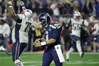  Seattle Seahawks quarterback Russell Wilson walks off the field after throwing an interception to New England Patriots strong safety Malcolm Butler during the second half of NFL Super Bowl XLIX football game Sunday, Feb. 1, 2015, in Glendale, Ariz.