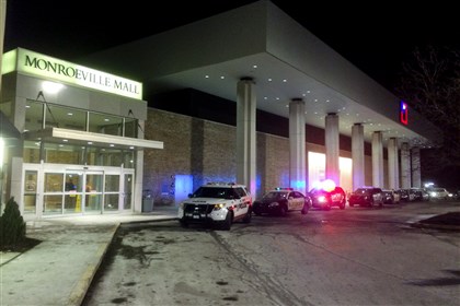 20150207bwShootingLocal.jpg 20150207bwShootingLocal Police vehicles line up outside Monroeville Mall Saturday night, after a shooting took place inside. Three people were injured.