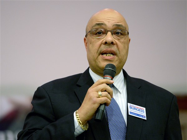 Protester questions board member’s link to land for Homewood community center