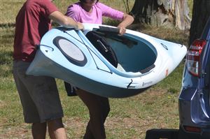  Scott Koski, left, and his wife, Sonya Koski, remove kayaks from their vehicle near North Park Lake. The Koskis are from Wintersville, Ohio.
