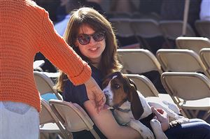  Sue, a 2-year-old hound mix who is up for adoption at Animal Friends, is greeted as she attends the ceremonial groundbreaking for the new Animal Wellness Center at the Animal Friends complex in Ohio Township. Holding Sue is Melanie Lippert, a staff member at Animal Friends.