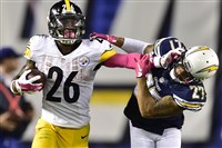  Steelers running back Le'Veon Bell stiff arms Chargers Jimmy Wilson picking up first down in the second quarter at Qualcomm Stadium, San Diego, Calif.