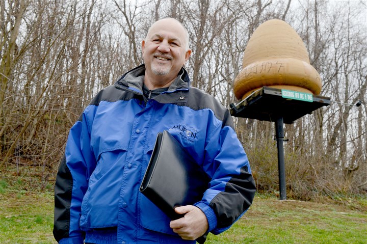 20151203ppUFOSUNLOC John Ventre, state director of the Mutual UFO Network, stands in front of a replica of an unidentified flying object that came down Dec. 9, 1965, in Kecksburg, Pa.