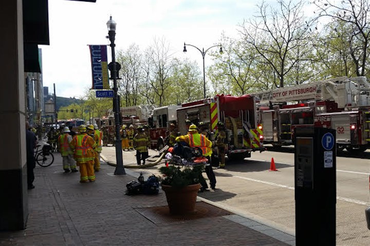 Firefighters respond to report of fire in Downtown high-rise, find man 'burning things in a barrel'