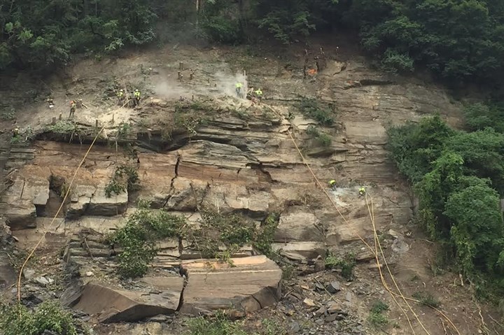 Norfolk Southern will use dynamite to remove loose rocks above West Carson Street