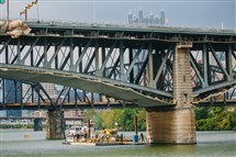  A barge used by repair crews to fix the Liberty Bridge sits below the bridge on the Monongahela River on Monday.