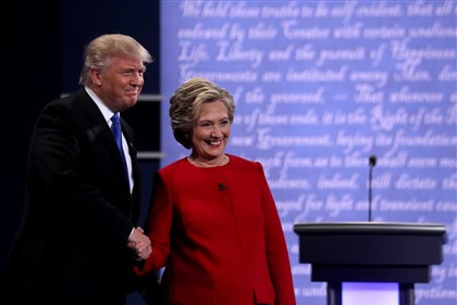  Democratic presidential nominee Hillary Clinton takes the stage with Republican presidential nominee Donald Trump during the Presidential Debate at Hofstra University on Monday in New York. 