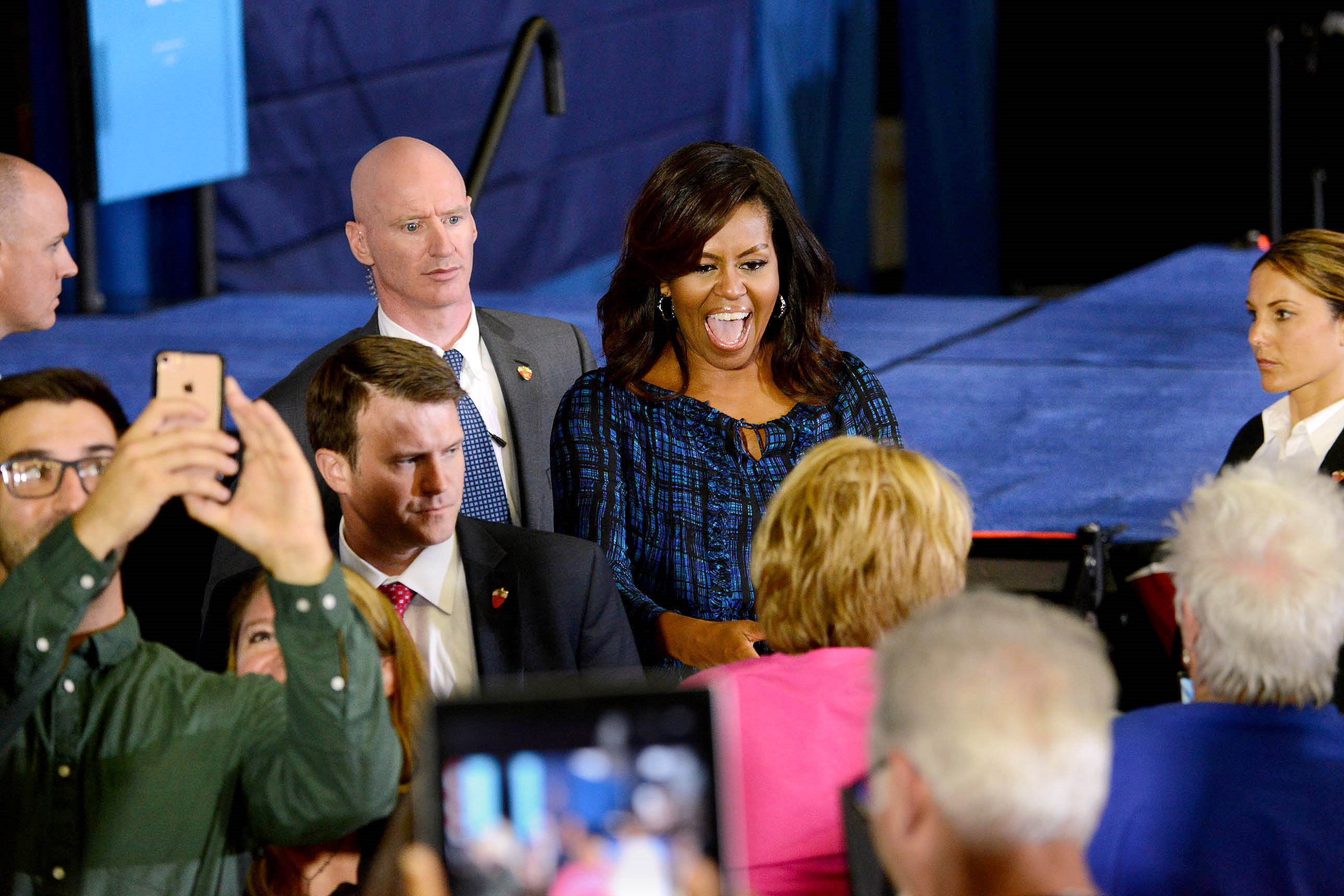 In stumping for Clinton, first lady criticizes Republican nominee