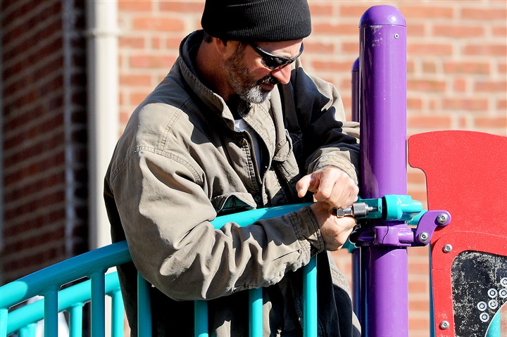 Volunteers build new playground in Homewood