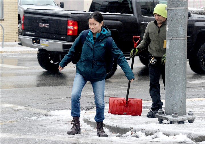 Ice storm hammers Pittsburgh, most T service resumes after shutdown