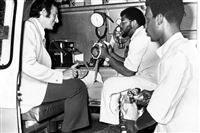 From left to right: Dr. Sidney Heller, Eugene Key, crew chief, and EMT Harold Brown of Freedom House.