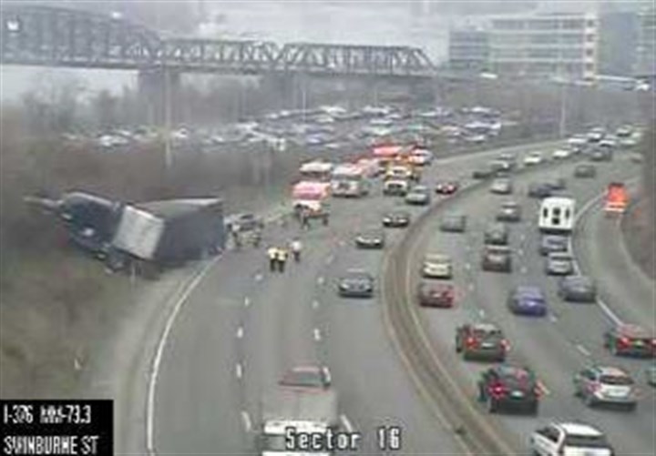 TRAFFIC: Tractor-trailer crash snarls Parkway East OB; Light-rail running 'off schedule' due to malfunction