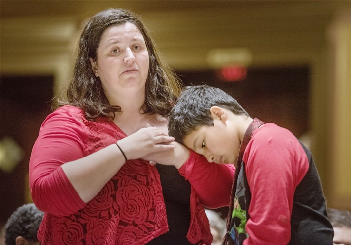 Town hall crowd sends message to lawmakers: Keep our insurance