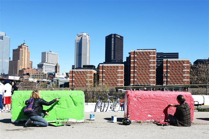 A splash of color on the riverfront: Opening day on trails mixes cyclists, artists