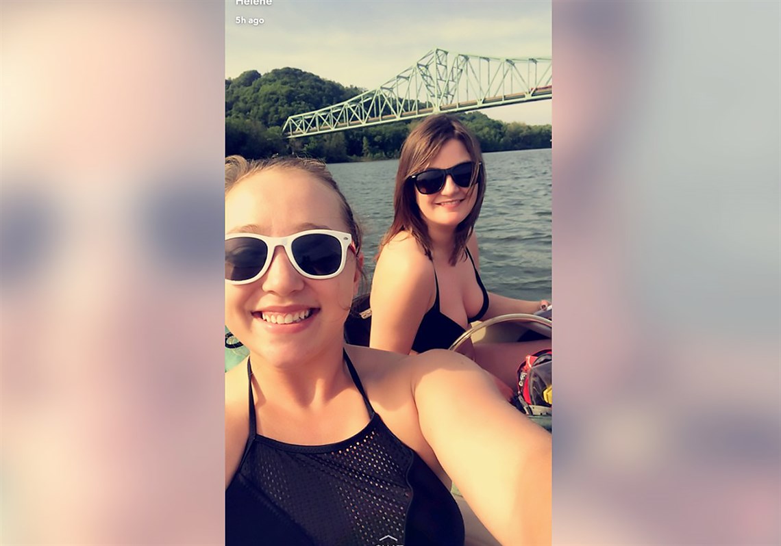 Helene Brandy, left, and Brittany Evans, both 25, snapped this photo the day they were were swept over the Dashields Dam on the Ohio River. Behind them is the Sewickley Bridge.