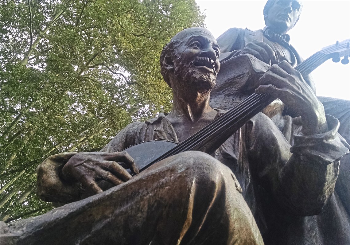 Statue of 19th-century American songwriter and Pittsburgh native Stephen Foster, depicted with an African-American musician. It was once located in Highland Park, but is now in Oakland.