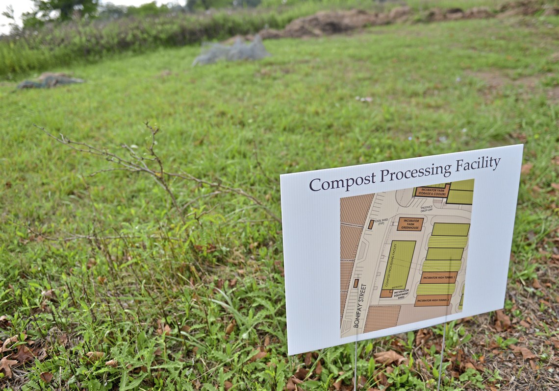 Signs posted along Bonifay Street in the former St. Clair Village illustrate the eventual use of an area in the Hilltop Urban Farm.
