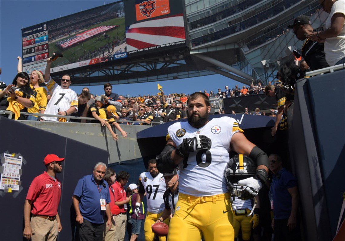 Steelers offensive lineman Alejandro Villanueva stands with his hand over his heart during the national anthem before the team's game Sunday in Chicago.