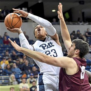 Pitt's Shamiel Stevenson drives to the net against Montana's Fabijan Krslovic in the first half of Monday's game at the Petersen Events Center.