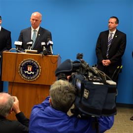 U.S. attorney David J. Hickton takes questions from the media on the recent cyberespionage case at FBI headquarters on the South Side. At left is Scott C. Smith, FBI special agent in charge, and right are J. Keith Mularski, FBI supervisory special agent, and Jimmy Kitchen, assistant U.S. attorney. 