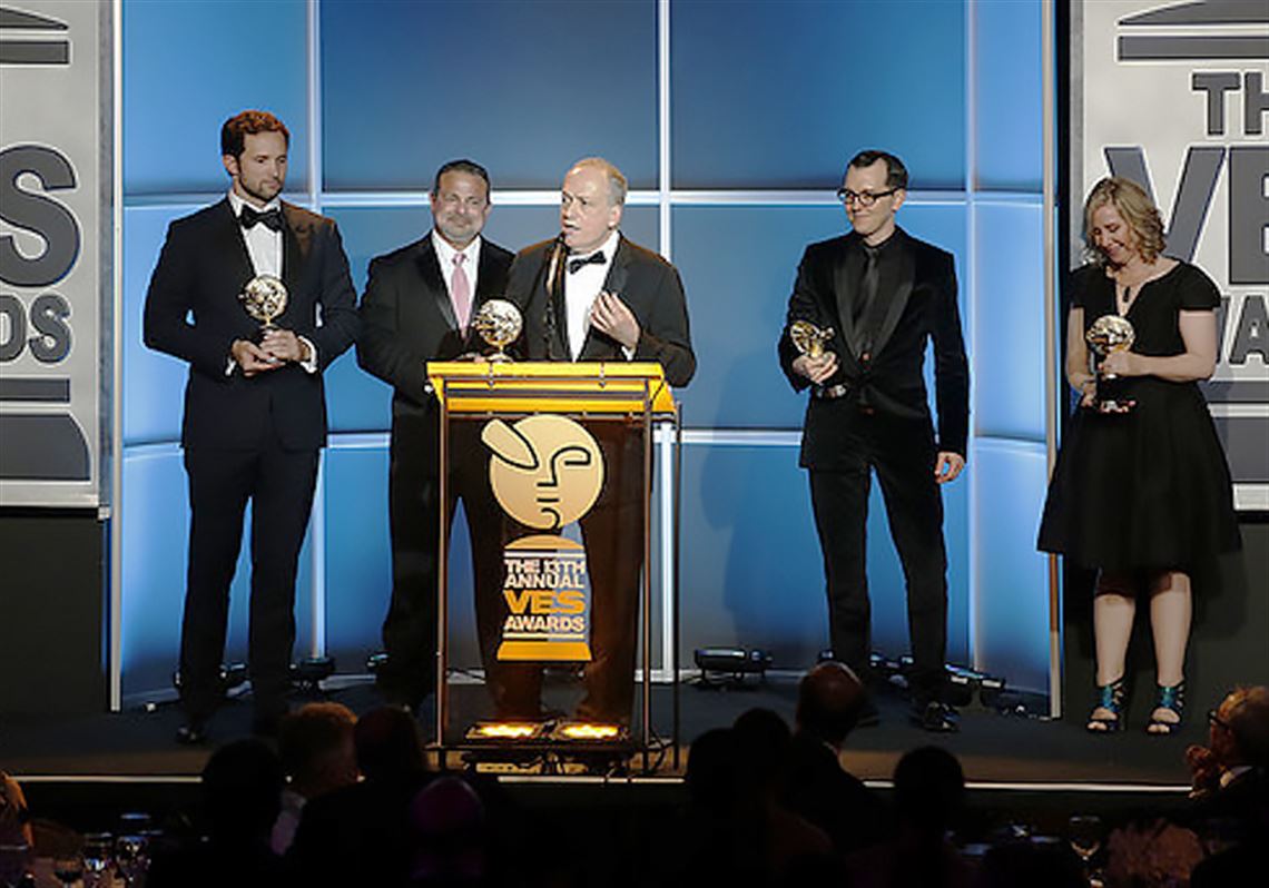 Joe Letteri accepts the award for Outstanding Visual Effects in a Visual Effects-Driven Photo Real/Live Action Feature Motion Picture, the top award at the 13th annual Visual Effects Society Awards, with his team from "Dawn of the Planet of the Apes."