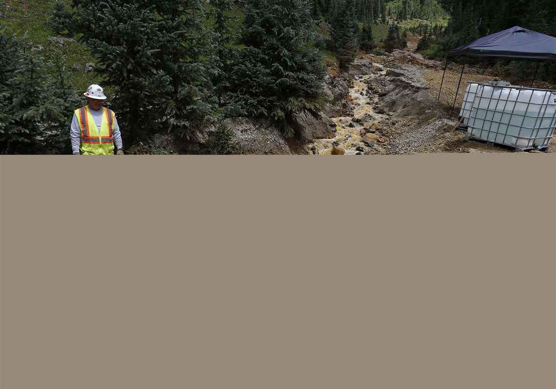 Environmental Protection Agency Administrator Gina McCarthy speaks during a news conference in August near the Durango, Colo., toxic waste spill site. In announcing the new rules on waste disposal standards, she said the limits on power plant water discharges will be phased in and provide public health benefits.
