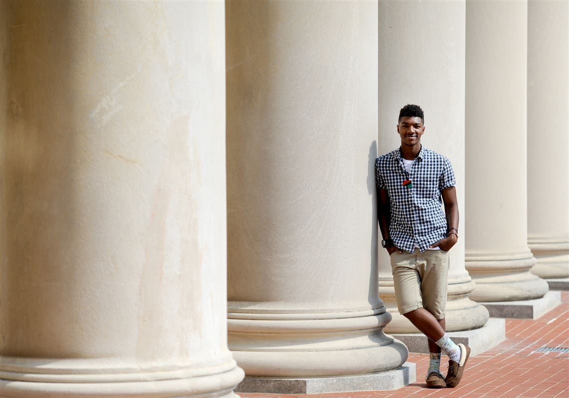 South Oakland native Teireik Williams, 20, a senior at Penn State University studying broadcast journalism, poses for a portrait outside Penn State’s Old Main.
