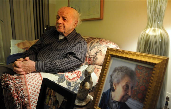 20160121JHLocalBaran02-1 Moshe Baran, 95, at home in Squirrel Hill. Portraits of his family and his wife sit on an end table near the couch.