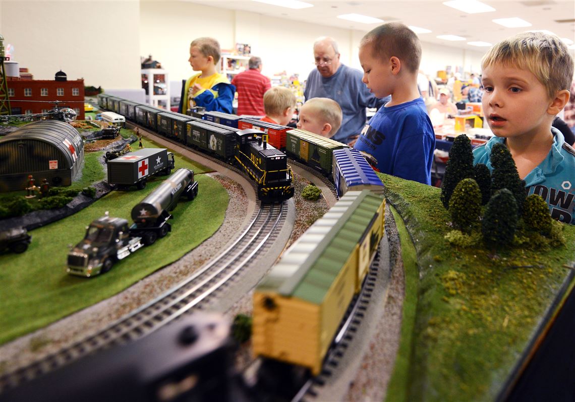 Jamie Carr, 5, right, of Greenfield checks a display during Sunday’s train show at the Castle Shannon Volunteer Fire Department’s Memorial and Fireman's Hall.
