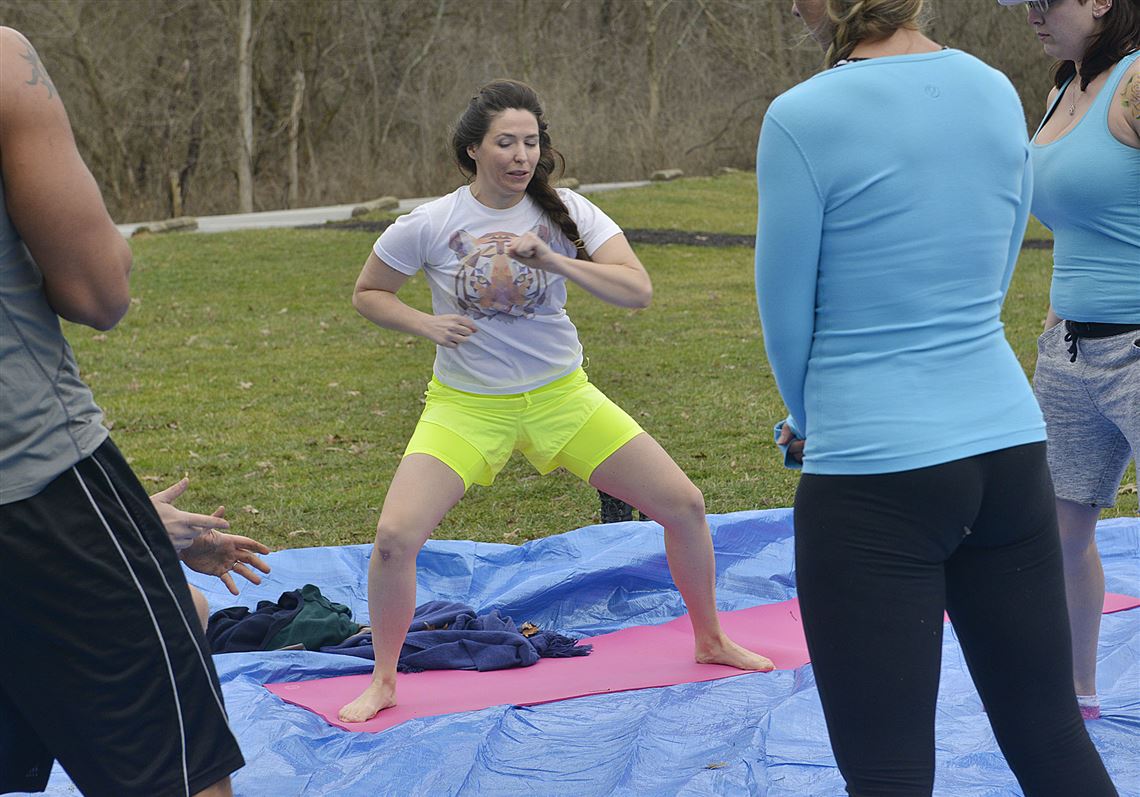 Jane Binakonsky runs through a series of conditioning and breathing exercises before entering  the icy water at Peters Lake Park.