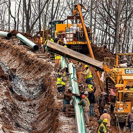 Workers lay a stretch of the Mariner East 2 pipeline in Washington County, Pa. The pipeline is to extend to Marcus Hook.