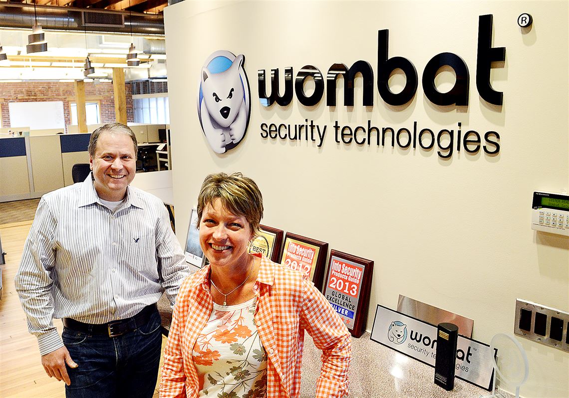 Wombat Security Technologies CEO Joe Ferrara, left, and vice president of marketing Amy Baker at the company's new Strip District offices.