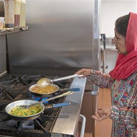 Iqbal Chatha prepares dal masoor,  a red lentil stew spiced with turmeric, chili and coriander, at Kabab and Curry Restaurant and Grill in Banksville.                                                  