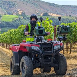 AI-powered cameras are seen mounted on an all-terrain vehicle. The system, developed by Lawrenceville-based Bloomfield Robotics, helps analyze the health of crops like grapes and blueberries.